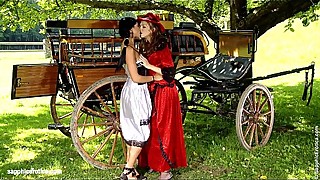 Classic period lesbians Juliette and Ashley have fun by the wagon