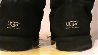 Crushing eggs in black Ugg Classic Tall